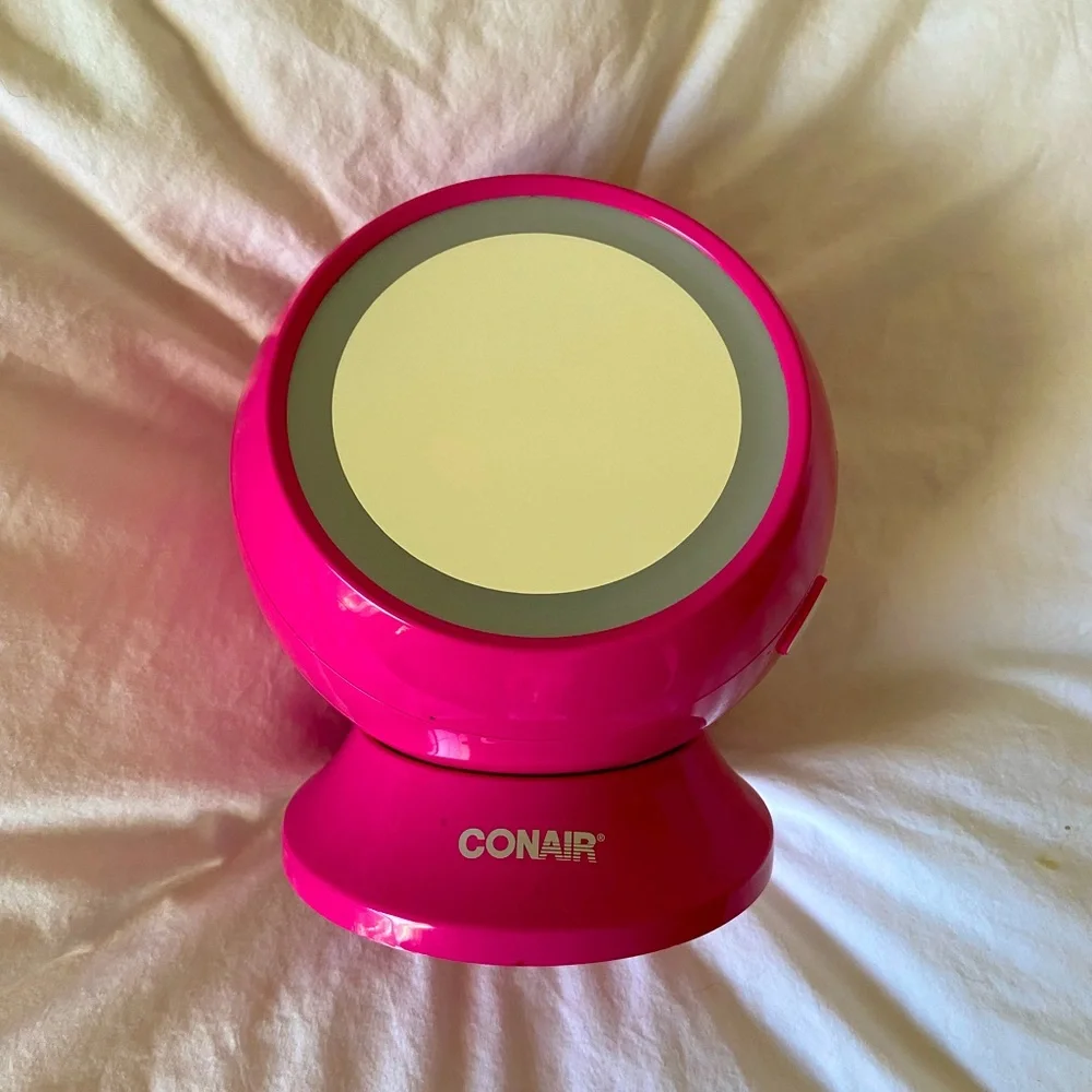 Conair mirror with light and jewelery storage.